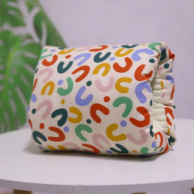 COUSSIN-ALLAITEMENT-TUYAU-BLANC-NOUILLES-COULEURS